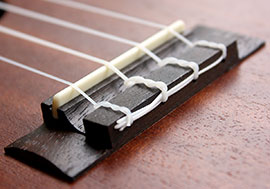 a ukulele bridge properly strung